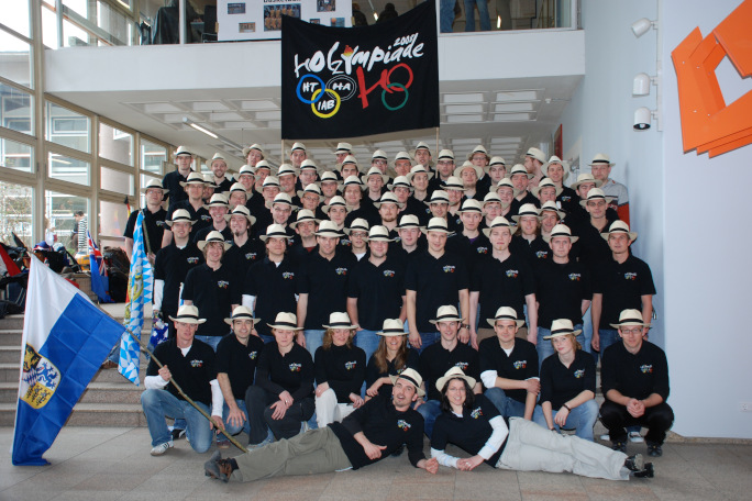 Wood technology students with traditional hat posing for a group picture 