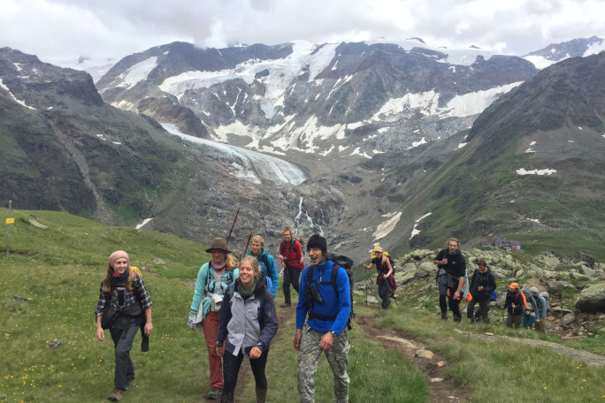 Group of students hiking up a mountain