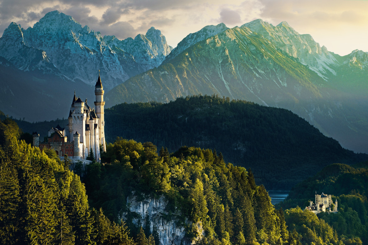 The famous castle "Neuschwanstein" in front of the Bavarian Alps.