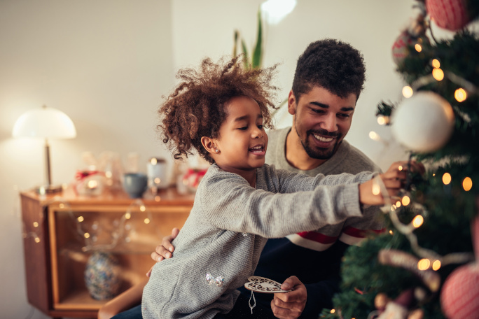 Father and son decorating their christmas tree