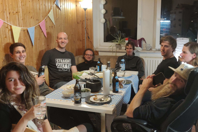 A group of students sitting around a table after a meal.