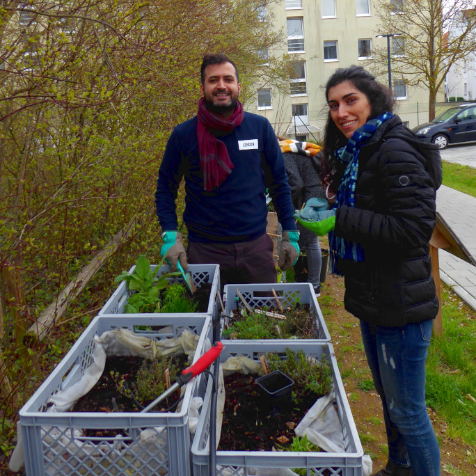 Two people selecting plants