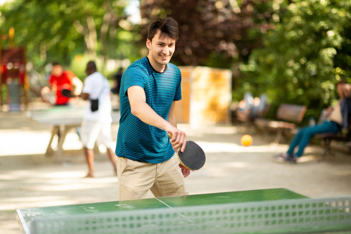 Guy playing table tennis