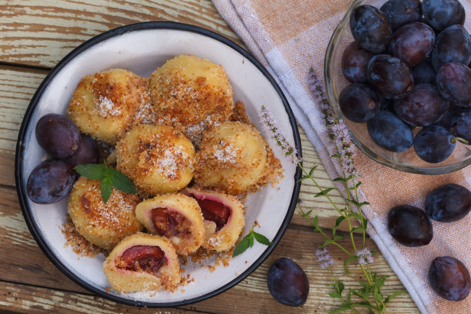 Sweet plum dumplings in a bowl.