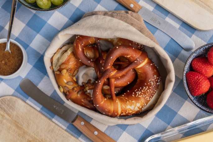 Bread basket filled with pretzels.