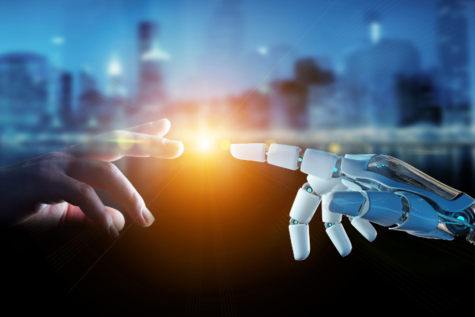 A spark glows between a human hand and a robotical hand