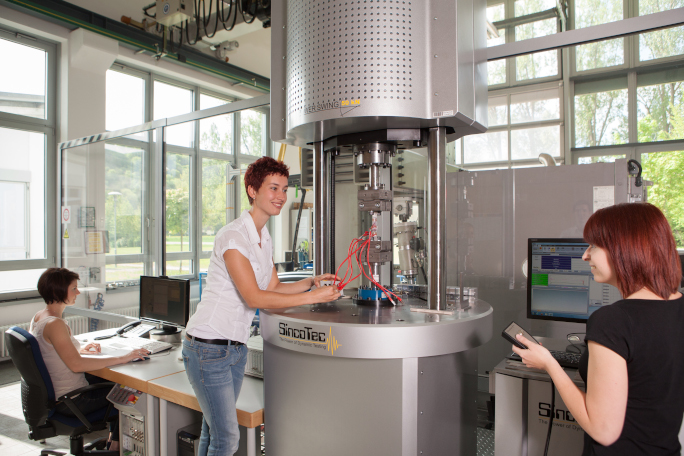 Three female researchers working in the lab