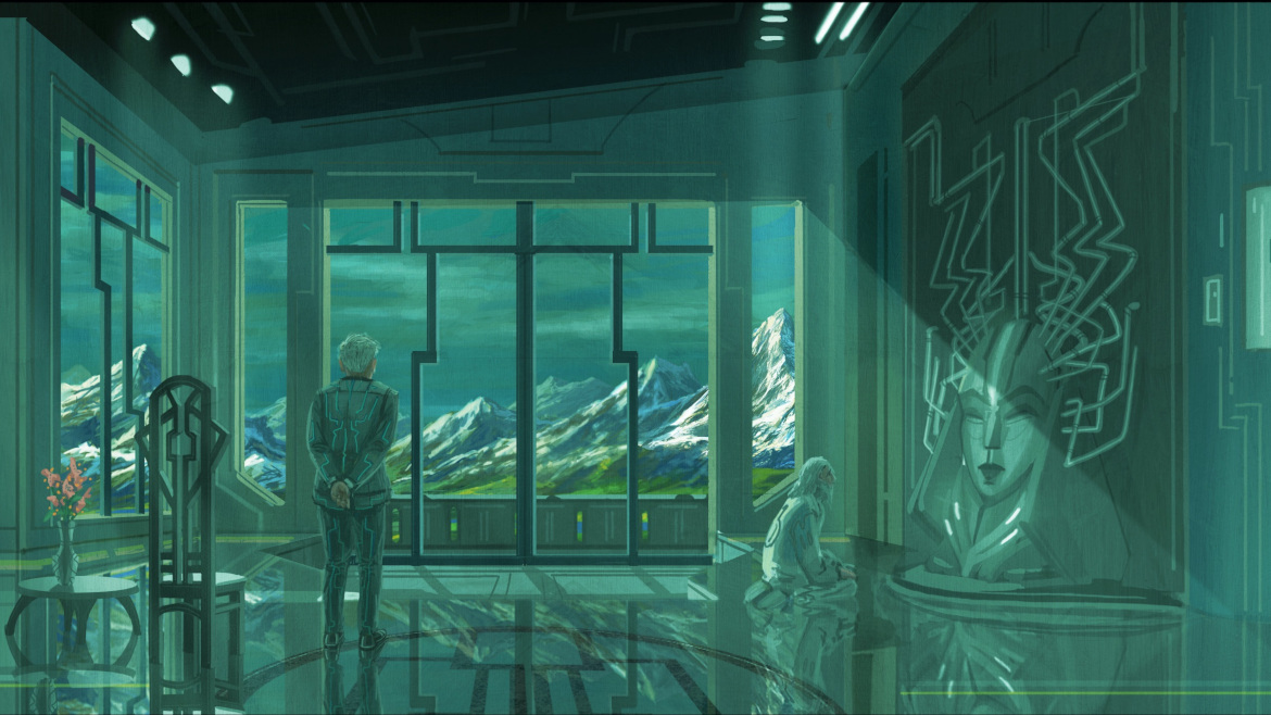 A man looking out of big windows with mountains in the background
