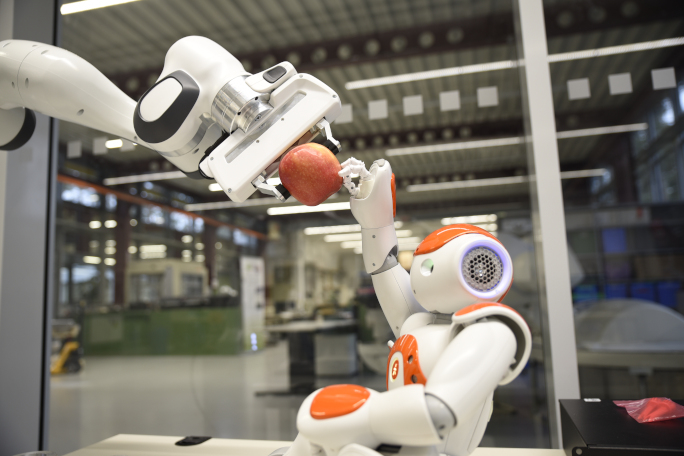 Robot reaching for an apple