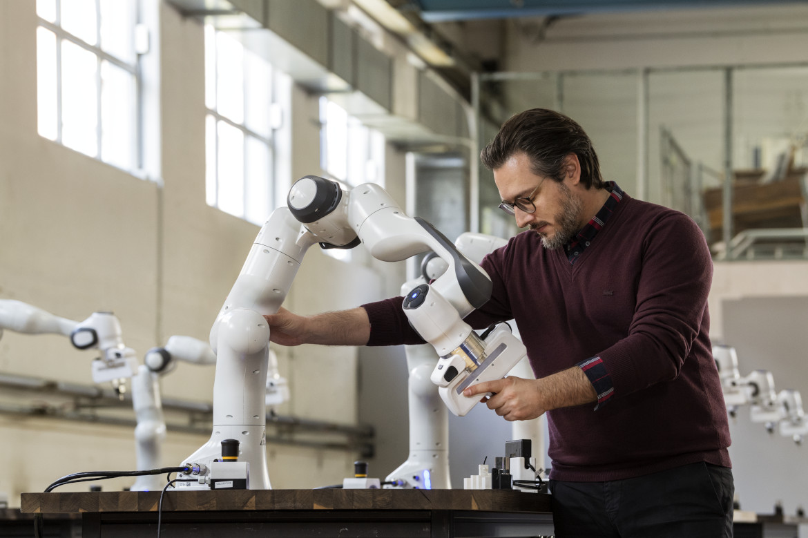 Prof. Sami Haddadin working with a robot